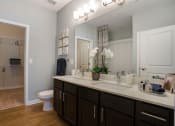 Thumbnail 9 of 78 - Spacious bathroom with two sinks and walk-in closet in Charlotte, NC Pointe at Prosperity Village apartment