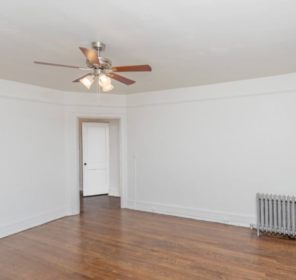 a bedroom with a bed and a door to a bathroom