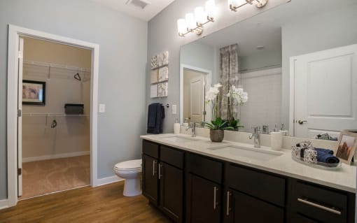 Spacious bathroom with two sinks and walk-in closet in Charlotte, NC Pointe at Prosperity Village apartment