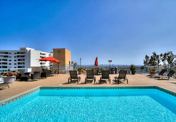 Umbrella Shaded Chairs by Pool at La Vista Terrace, Hollywood, 90046