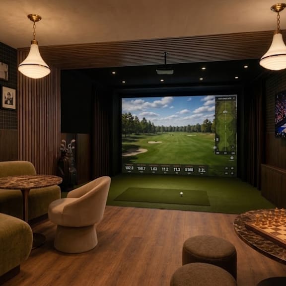 A room with a large screen and a chessboard.