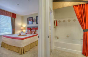 Vue Park West bedroom and attached bathroom with large soaking tub/shower combo