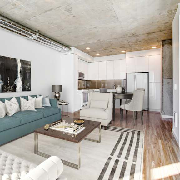 A modern living room with a blue couch and a coffee table.