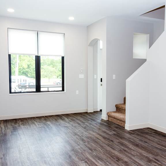 A room with a staircase leading to the second floor.