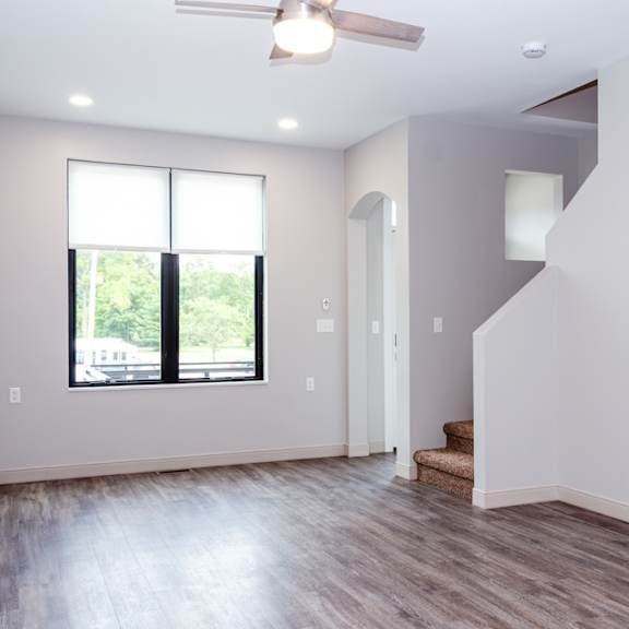 A room with a staircase and a window.