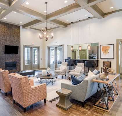a living room filled with furniture and a fire place