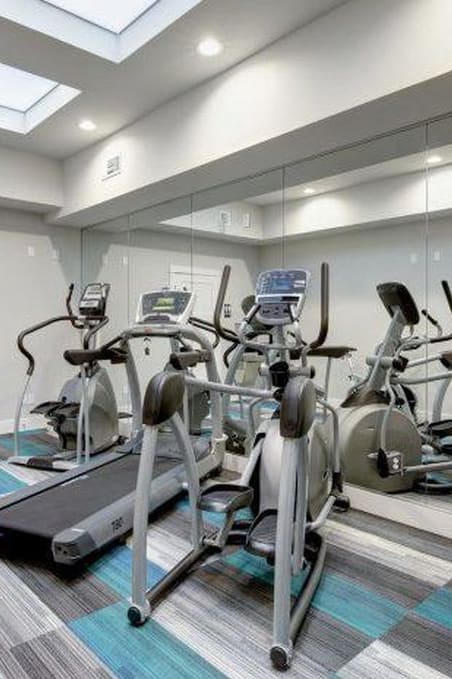 a gym with a lot of exercise equipment