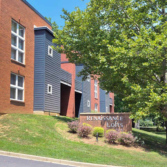 a brick building with a sign that reads renaissance lodges
