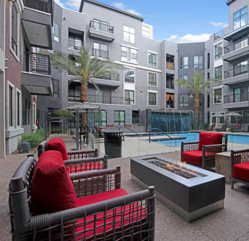a firepit and lounge area at the bradley braddock road station apartments