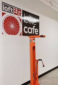 A bike cafe with orange pipes on the wall. at LOFT 205 Apartments, Reno, NV