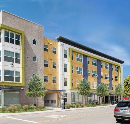 a new apartment building on the corner of a city street