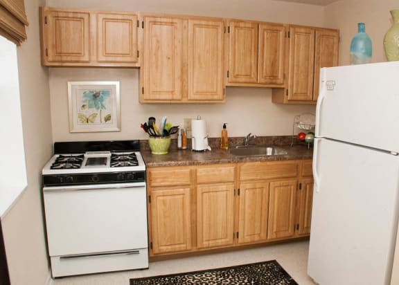 kitchen with gas range, wood cabinetry and energy efficient appliances at ridgecrest village in washington dc