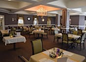 Thumbnail 4 of 6 - a dining room with tables and chairs