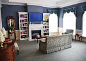 Thumbnail 2 of 5 - a living room with a couch and a fireplace
