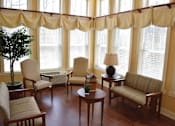 Thumbnail 2 of 5 - a living room filled with furniture and windows with curtains