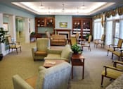 Thumbnail 3 of 5 - a living room filled with furniture and a table and chairs
