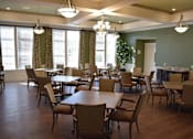 Thumbnail 3 of 5 - a dining room with tables and chairs