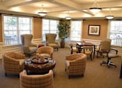 Thumbnail 1 of 5 - a living room filled with chairs and a table