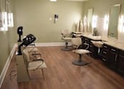 Thumbnail 4 of 5 - a salon room with two sinks and chairs and a mirror