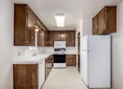 Thumbnail 9 of 22 - Modern Kitchen With Custom Cabinet at Barcelona Apartments, California, 93277