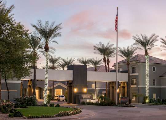 The Highland front entrance from the street at sunset