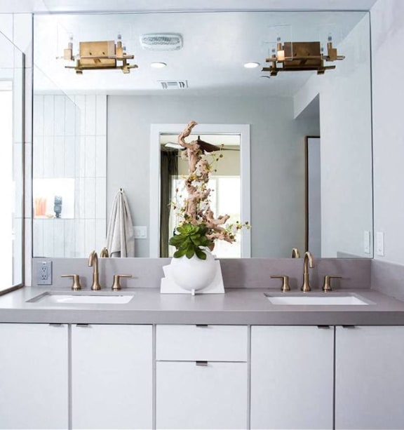 a white bathroom with two sinks and a large mirror at Novella Arcadia, Arizona