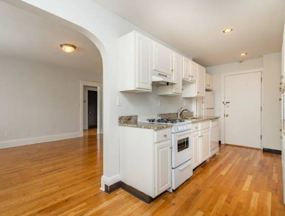 a large kitchen with a counter top and