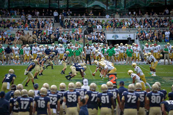 a football game is being played in a stadium at The Foundry Apartments , South Bend, IN, 46617
