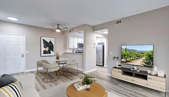 A living room with a television and a coffee table.