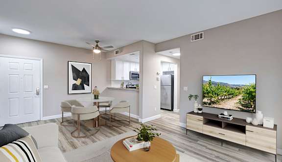 A living room with a television and a couch.
