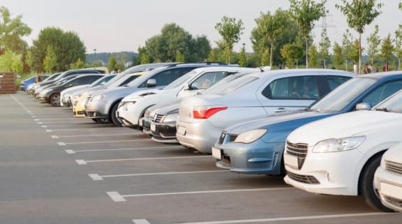 a row of cars parked in a parking lot at Windsor Crossing Senior, Suitland, MD 20746