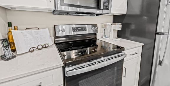 a kitchen with a stove microwave and refrigerator