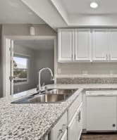 a kitchen with a sink stove and dishwasher at Aspire Corona, California, 92882