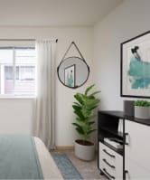 A bedroom with a bed, nightstand, and a plant. at Fort Vancouver Terrace, Vancouver, WA, 98661