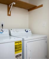 A small laundry room with a washer and dryer. at Fort Vancouver Terrace, Vancouver, WA, 98661