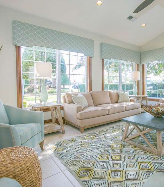 A dining room with a table set for six.