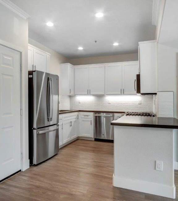 a kitchen with white cabinets at Toluca Court, Toluca Lake, CA