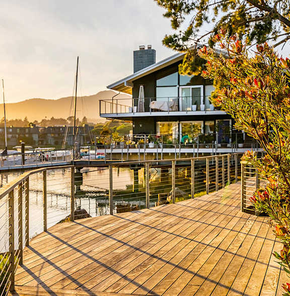 Outdoor walkway at dusk at The Cove at Tiburon Apartments in Tiburon CA