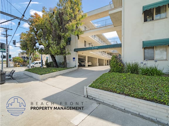 A building with the words "Beach Front Property Management" on the bottom left corner.