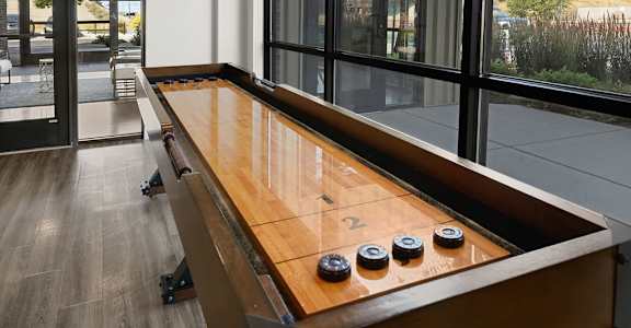 A shuffleboard table with the number 2 on it.