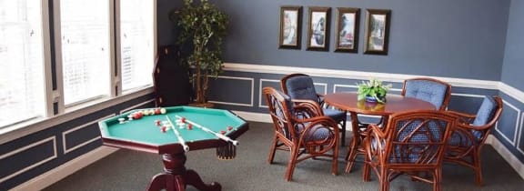 a group of people giving each other a high five in a living room