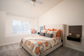 Model Master Bedroom with wall to wall carpet, ceiling fans and large window seat