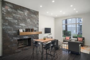 Game Room with fireplace, hightop table, and seating area