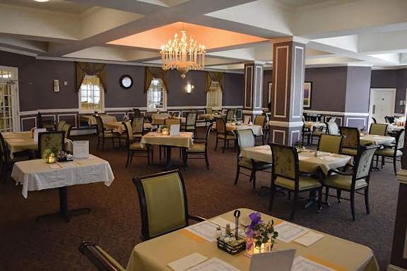 a dining room with tables and chairs