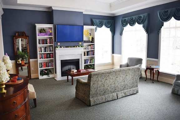 a living room with a couch and a fireplace