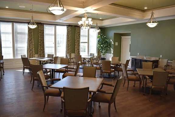 a dining room with tables and chairs