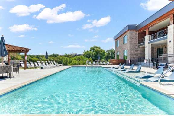 Northside at the Woodlands Resort-Style Swimming Pool with Tables and Chairs