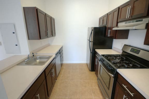 Kitchen with stainless steel appliances and wooden cabinets