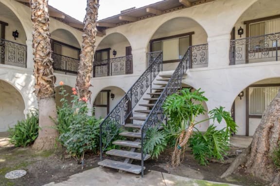 Backyard Of property With Staircase at Barcelona Apartments, Visalia