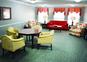 Thumbnail 3 of 4 - a living room with couches and chairs and a table